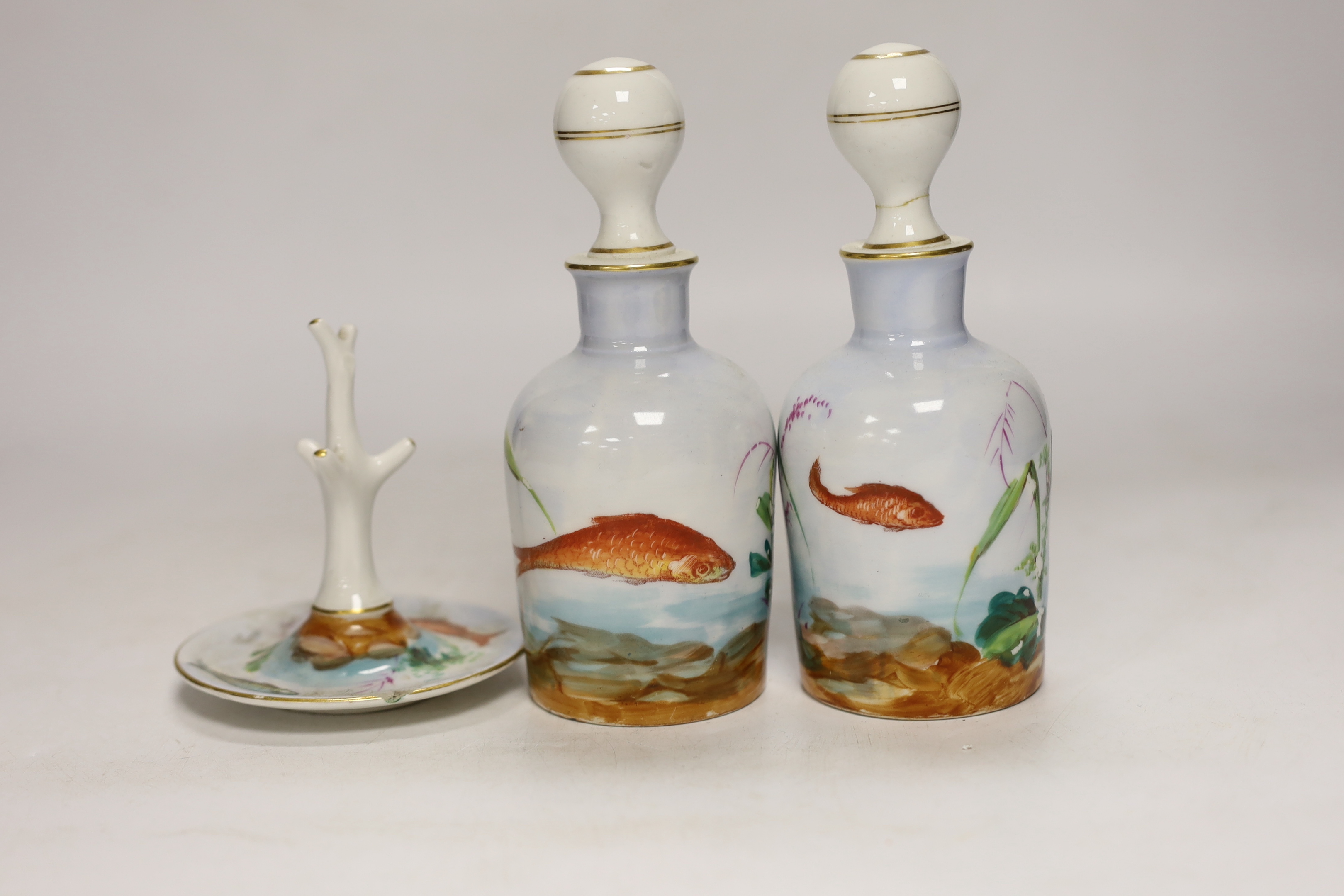 A fish and gilt decorated eight piece dressing table set, two glass scent bottles, two Halcyon Days pots and a Worcester plate, plate 25cm high